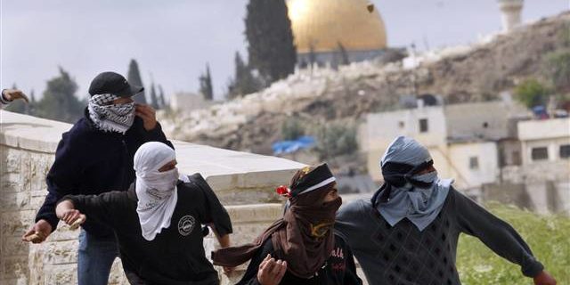 Palestinian throwing stones